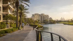 Scenic waterfront promenade at Dubai The Views featuring luxury residential apartments, palm trees, landscaped walkways, and skyline views in a premium Dubai community.
