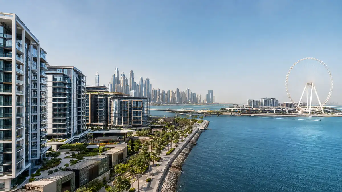 Bluewaters Island waterfront in Dubai with luxury residences, Ain Dubai and the Dubai Marina skyline across the Arabian Gulf.
